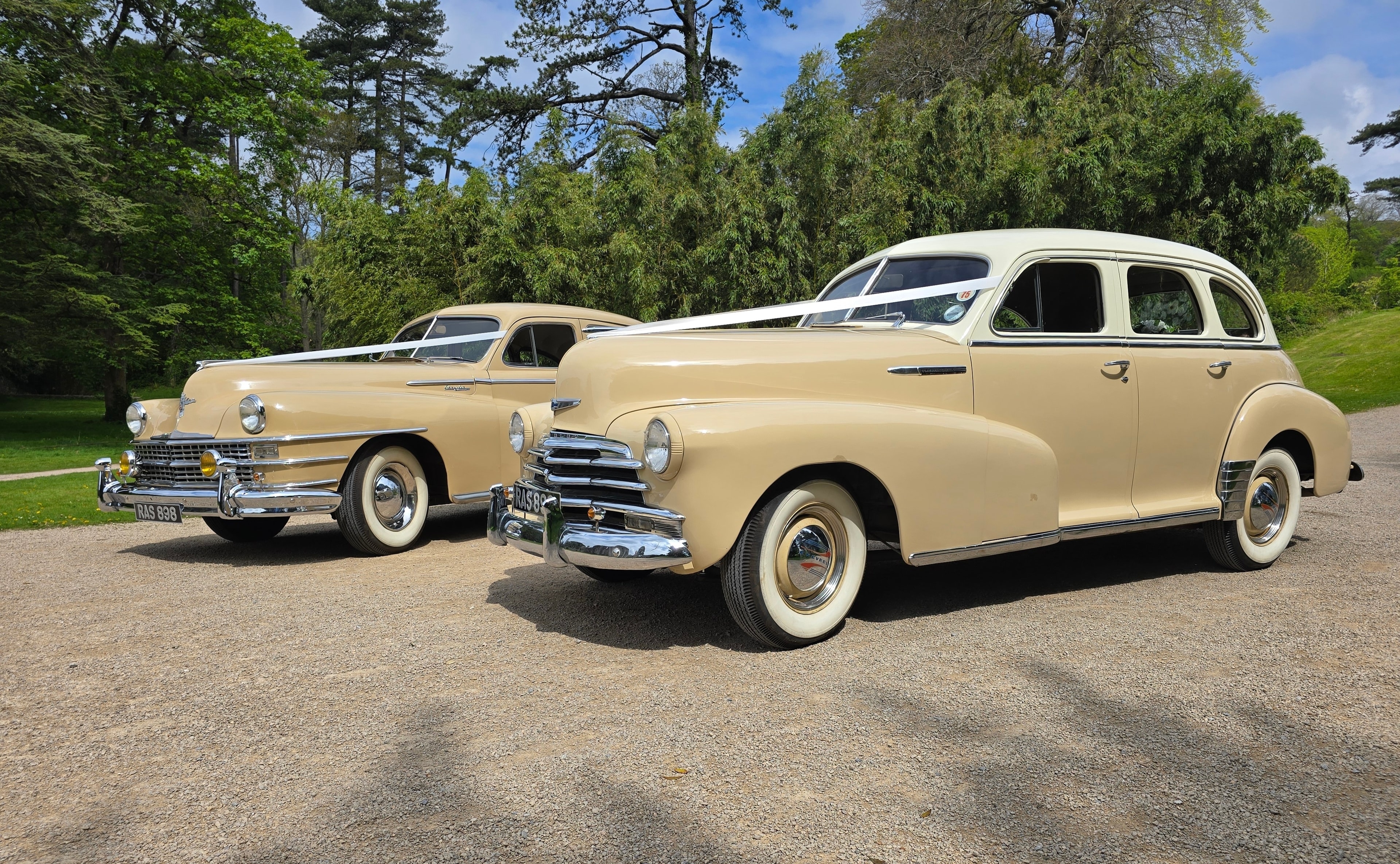 Bride and groom in a vintage wedding car